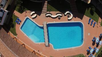 Outdoor pool, pool umbrellas, pool loungers