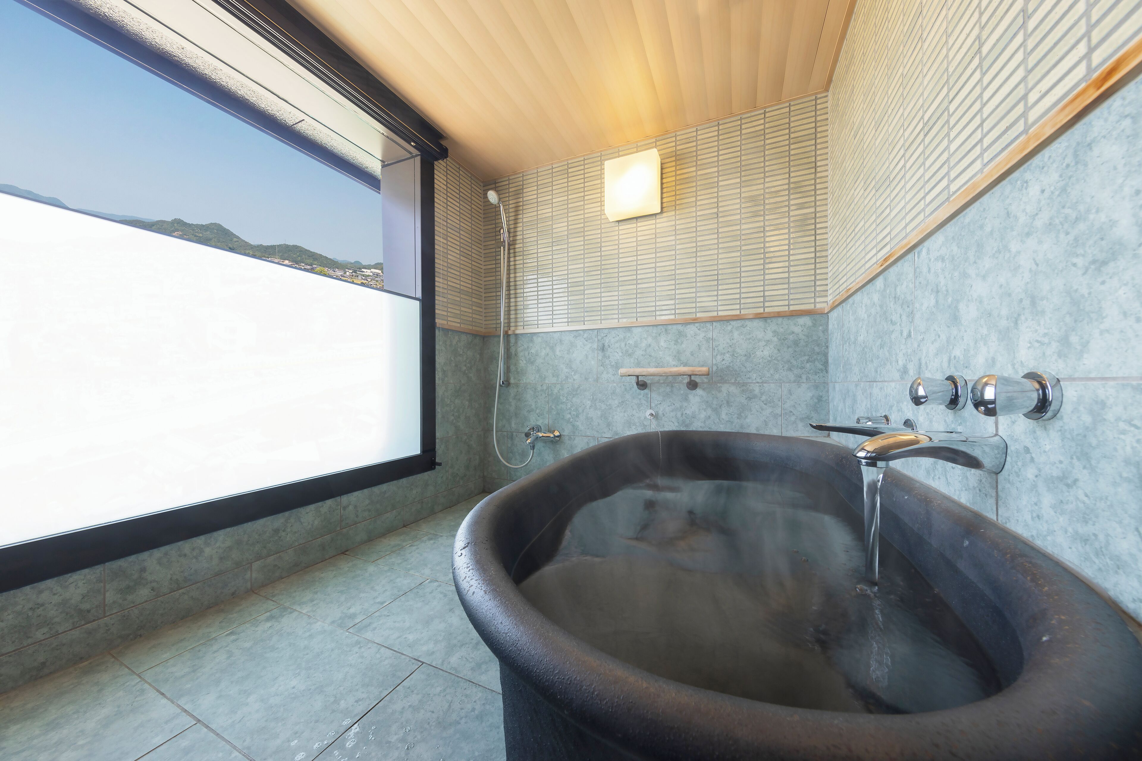 corner suite-sansoka with open-air bath (non-smoking) | bathroom | combined shower/bathtub, deep-soaking bathtub, rainfall showerhead