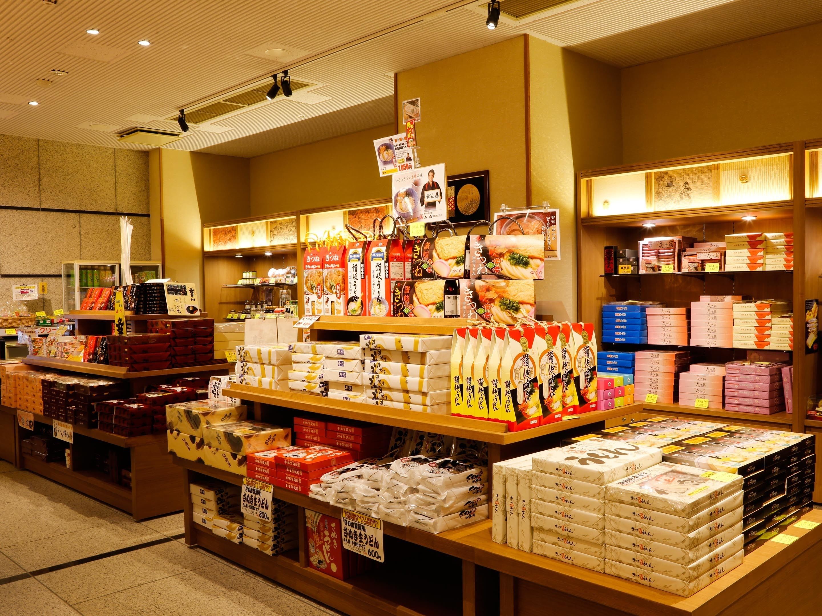 A bookstore with shelves stocked with books and magazines.