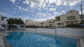 Seasonal outdoor pool, pool umbrellas, pool loungers