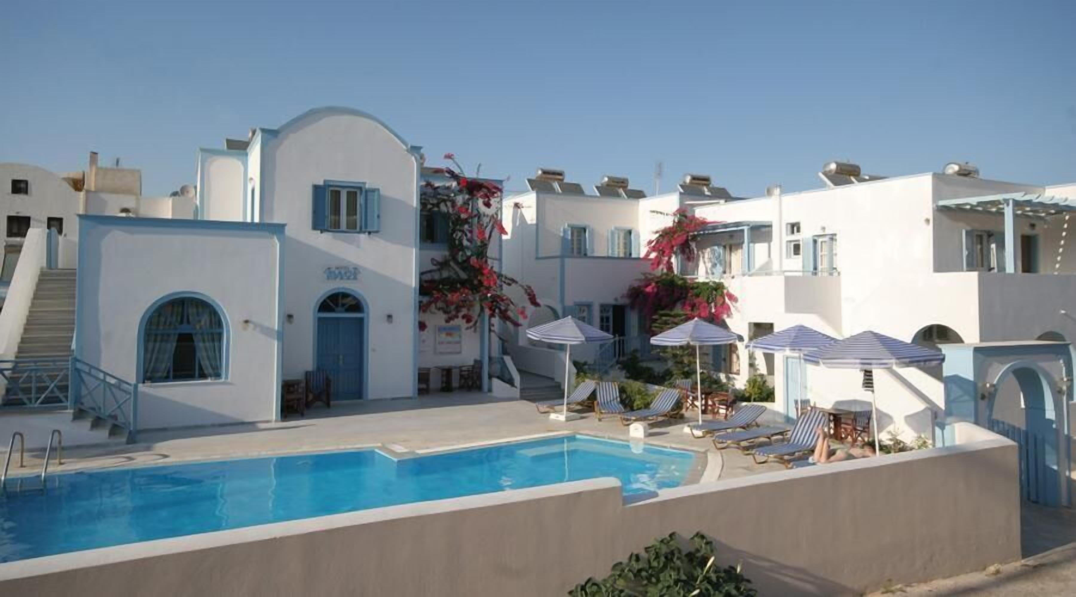 seasonal outdoor pool, pool umbrellas, pool loungers