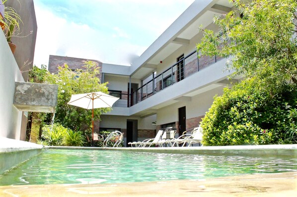 Outdoor pool, open 9:00 AM to 8:00 PM, pool umbrellas, pool loungers