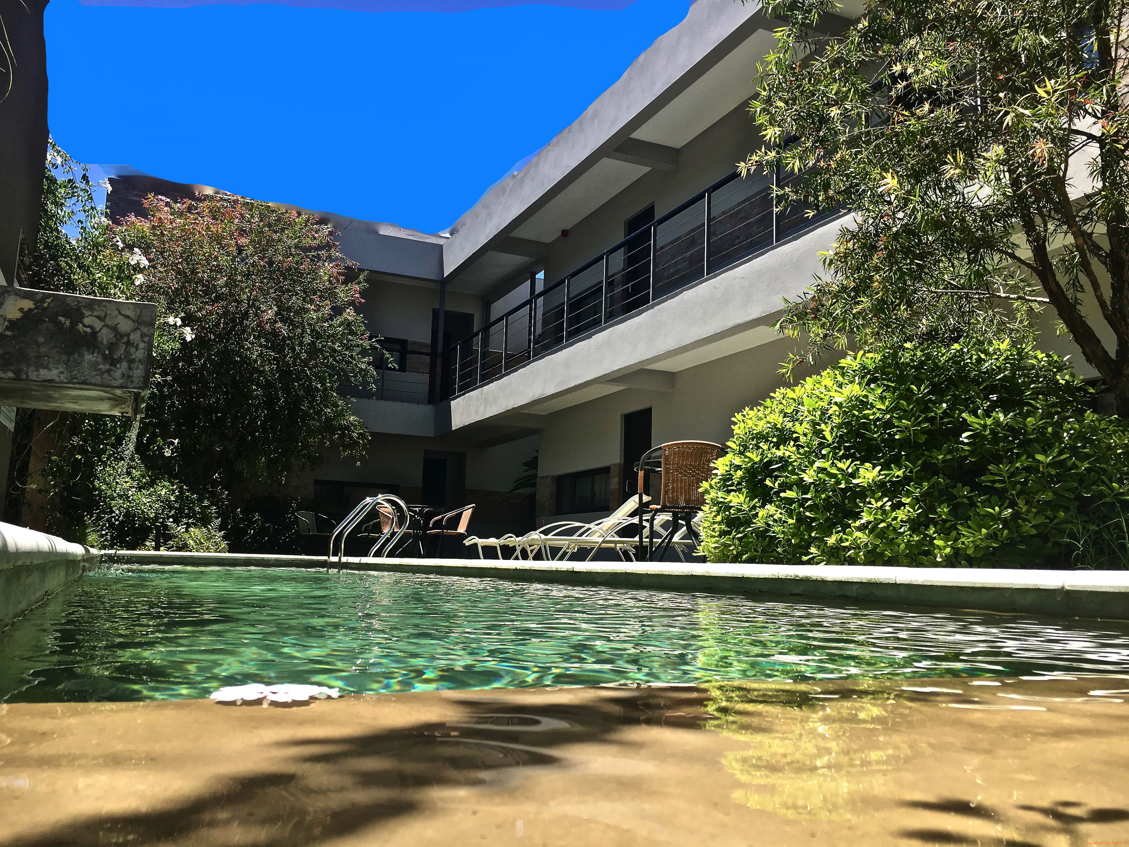 outdoor pool, open 9:00 am to 8:00 pm, pool umbrellas, pool loungers