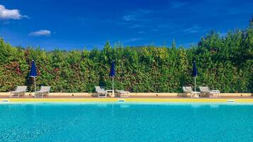 Seasonal outdoor pool, pool umbrellas, sun loungers
