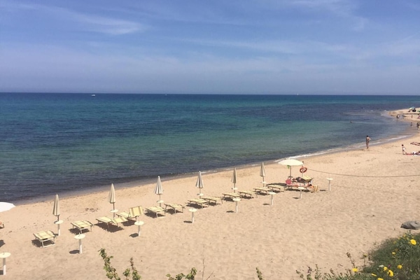 Private beach, white sand, sun loungers, beach umbrellas