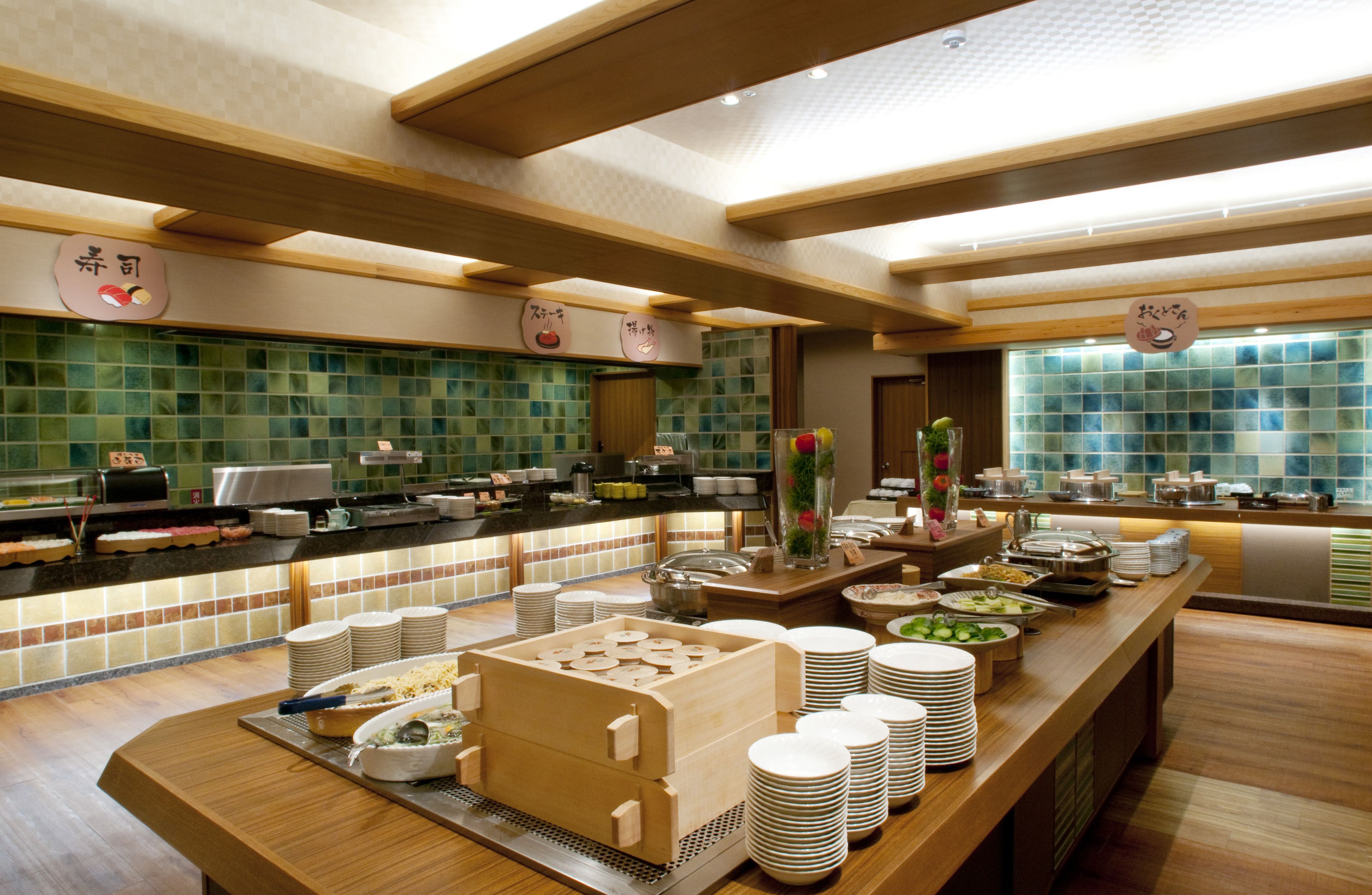 A buffet setup with multiple food stations and a variety of dishes.