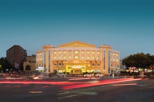 A large, multi-story hotel with a prominent entrance and a symmetrical facade.
