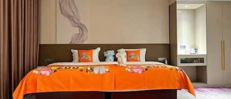 A hotel room with a large bed, a zebra-themed rug, and a wall with a zebra illustration.