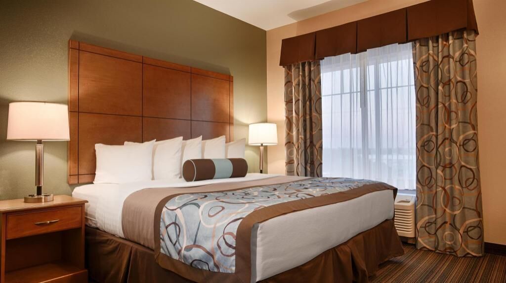 Premium bedding, pillow-top beds, desk, laptop workspace