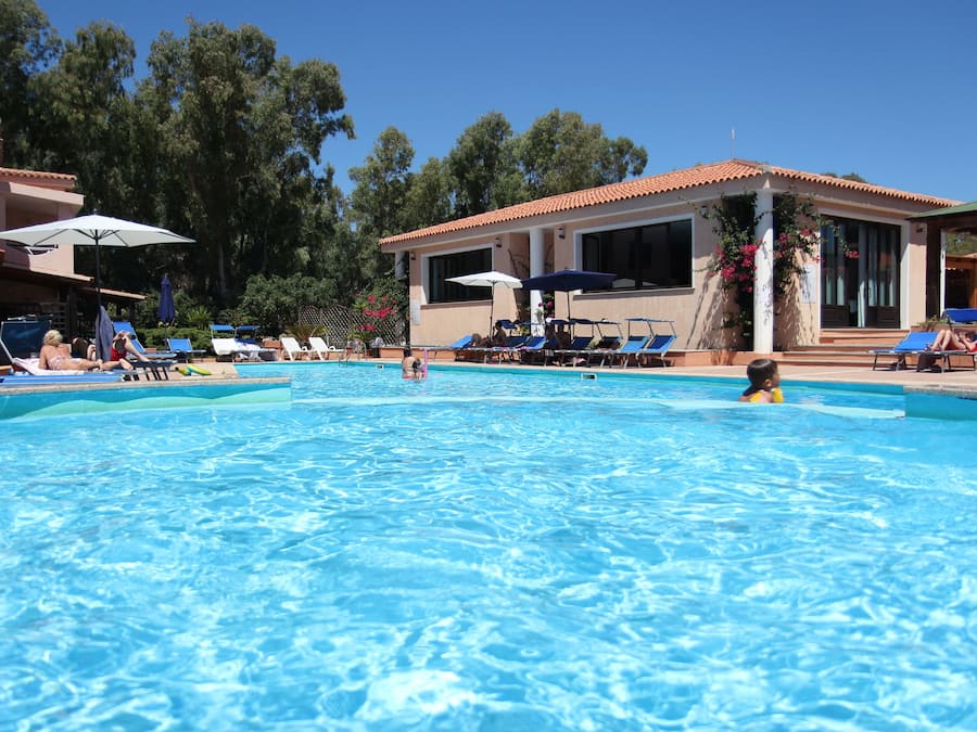 Outdoor pool, open 9:00 AM to 7:00 PM, pool umbrellas, pool loungers