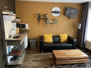 Desk, laptop workspace, blackout drapes, iron/ironing board