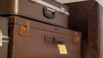 Two brown suitcases stacked on top of each other.