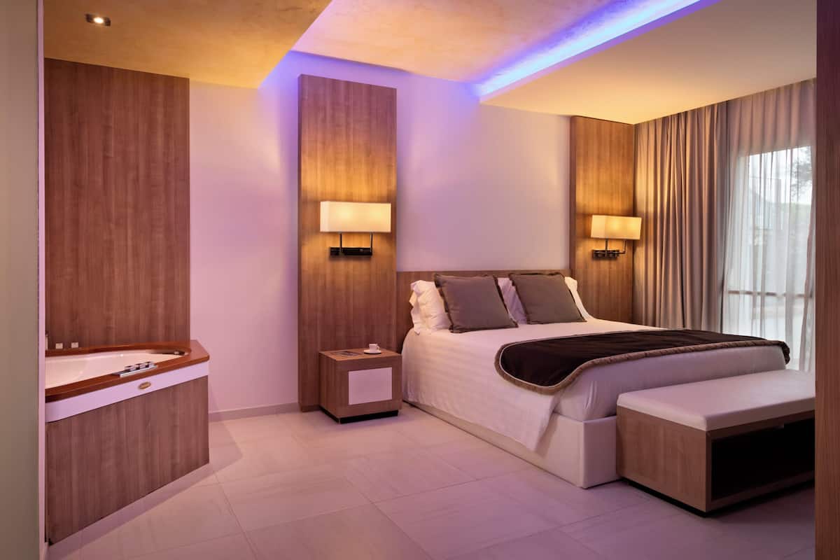 Suite Garden View | Sábanas italianas Frette, ropa de cama de alta calidad y edredón
