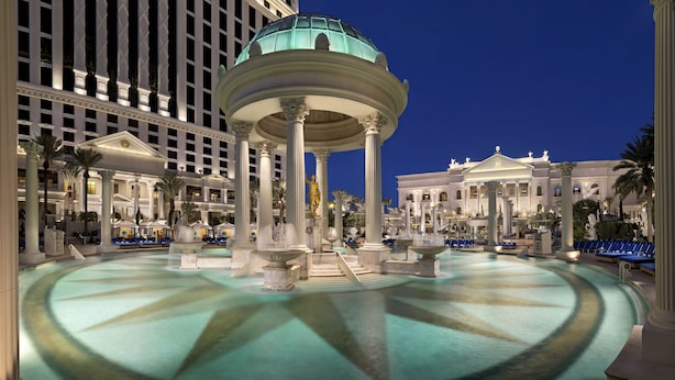 A grand hotel atrium with a central fountain, large columns, and a domed ceiling. - NOBU Las Vegas – A Caesars Rewards Destination (Las Vegas)