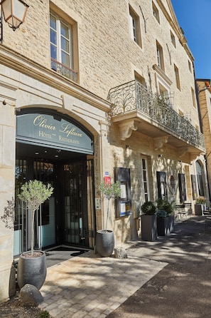 A building with a sign for 'Olivier Leflaive Hotel Restaurants.' - Olivier leflaive (Puligny-Montrachet)
