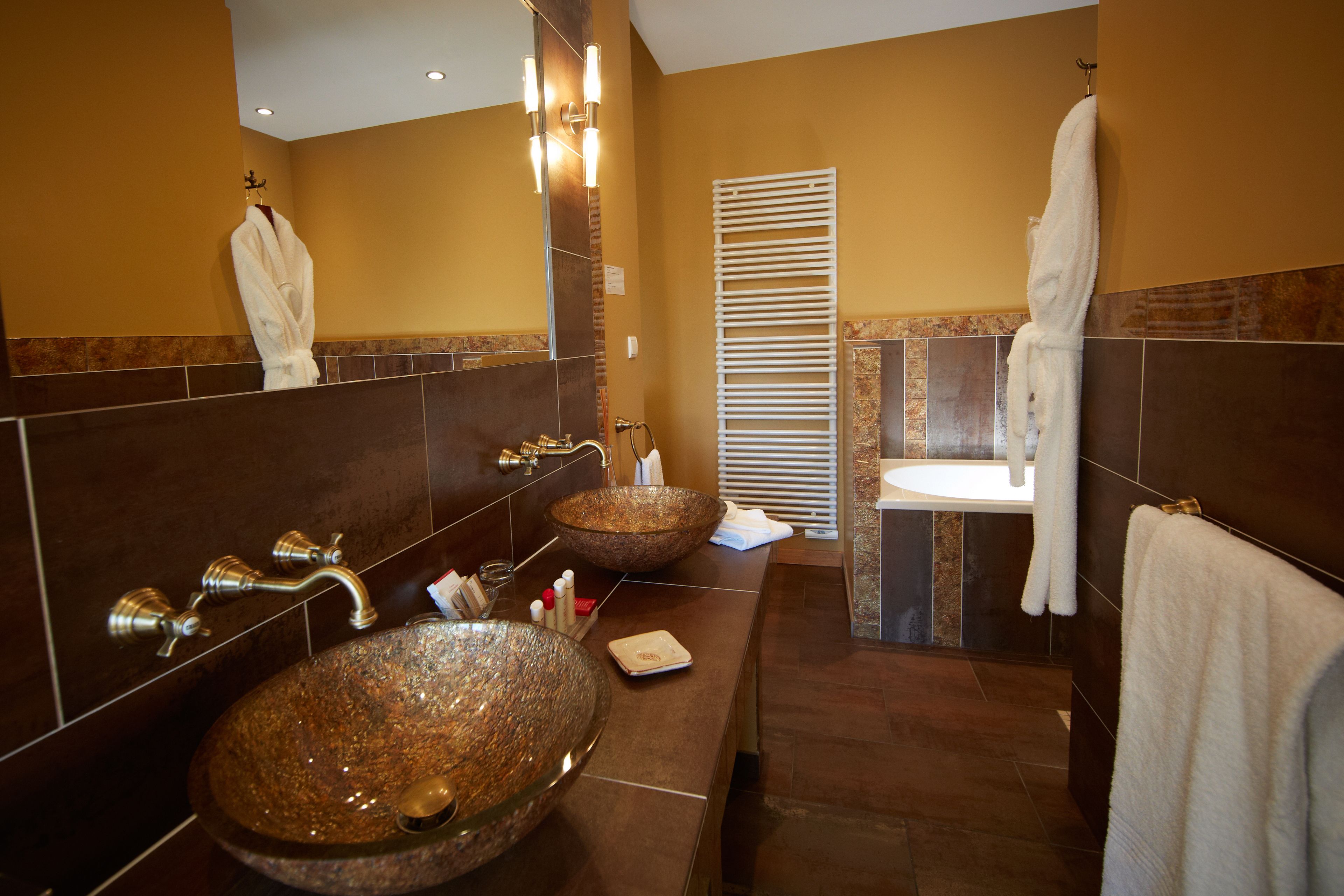 junior suite | bathroom | designer toiletries, hair dryer, slippers, towels