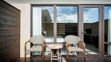 Deluxe Quadruple Room, 2 Queen Beds, Bathtub-Parking Available | Terrace/patio