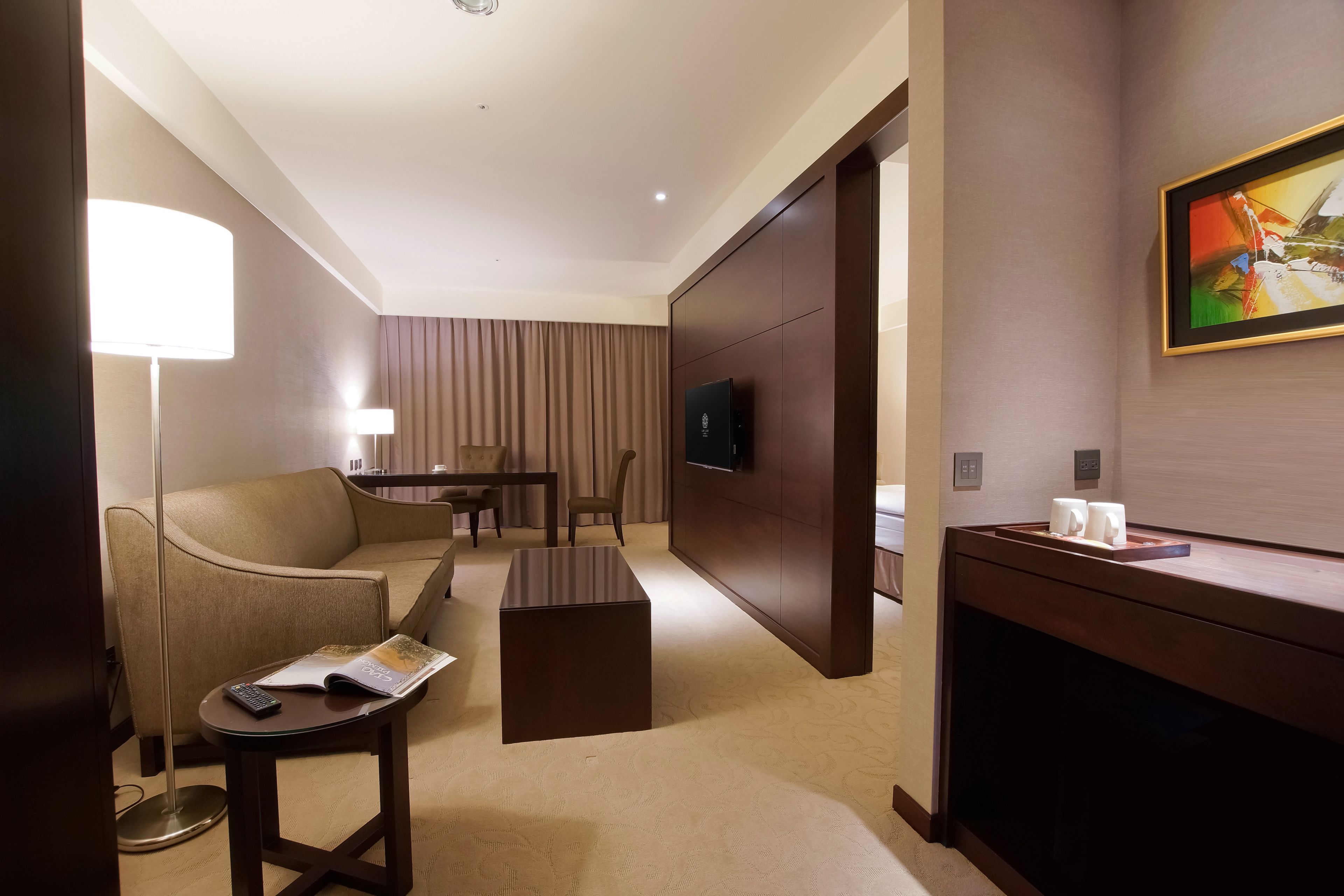 deluxe quadruple room, 2 queen beds, bathtub-parking available | living area | lcd tv