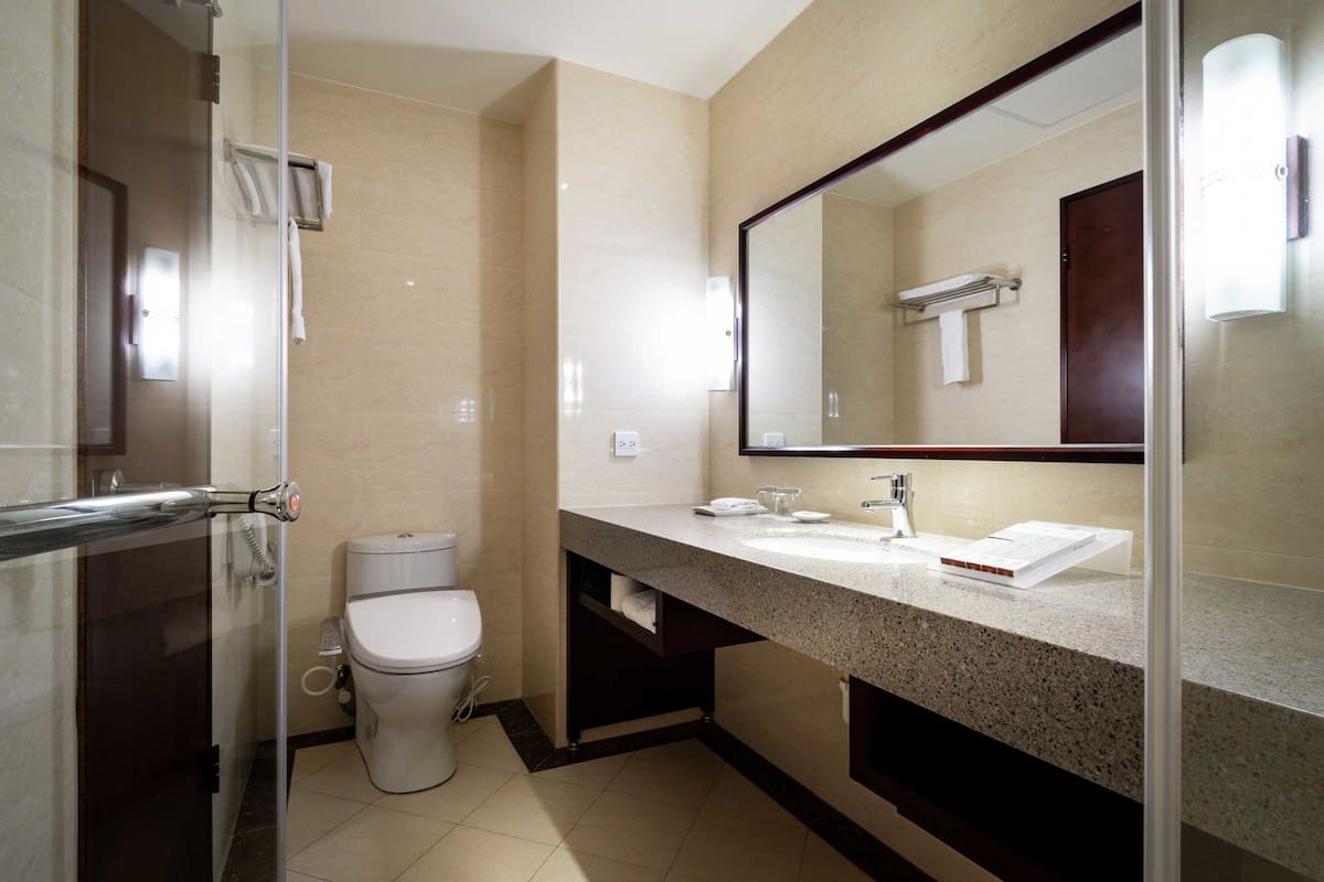 no parking-superior room-interior-double | bathroom | hair dryer, slippers, bidet, towels