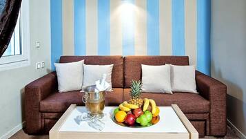 Superior Double Room, Lake View | Living room | TV