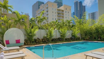Outdoor pool, open 7:00 AM to 11:00 PM, sun loungers