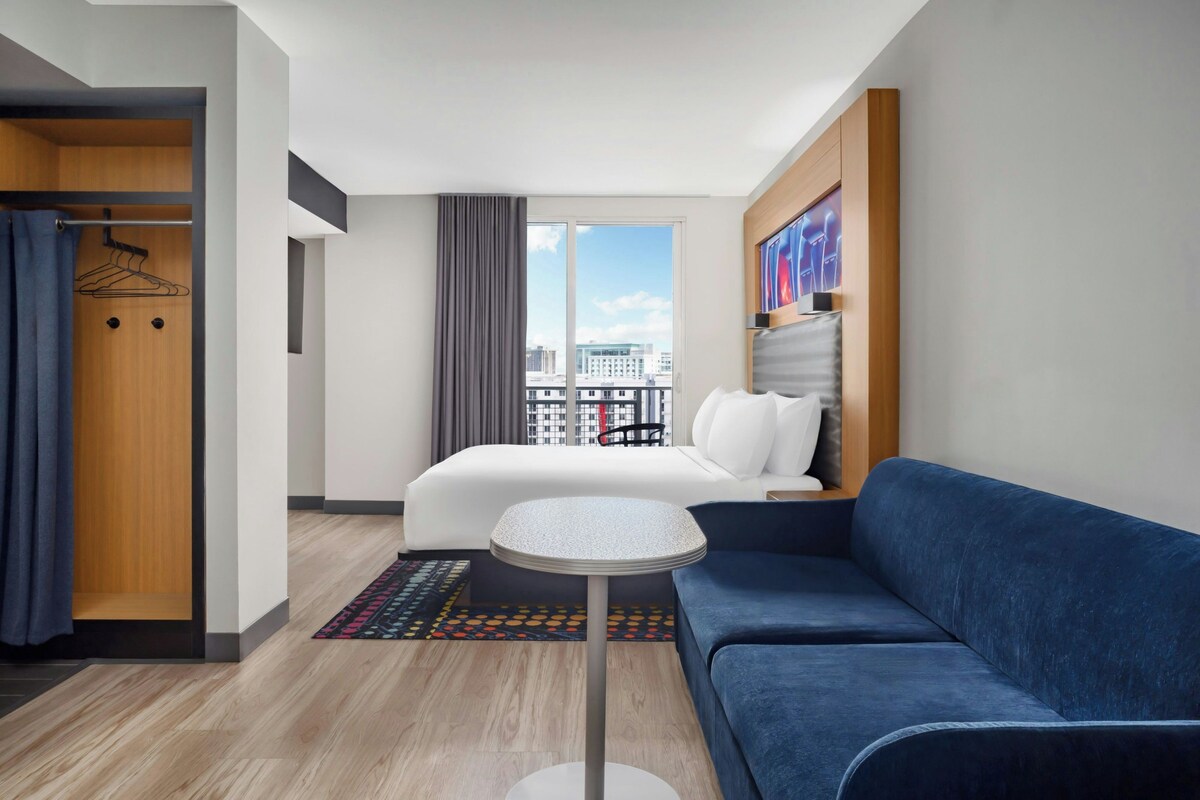 Room, 1 King Bed with Sofa bed, Balcony | Living area | 42-inch LED TV with premium TV channels, TV