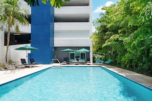 Outdoor pool, open 7:00 AM to 11:00 PM, sun loungers