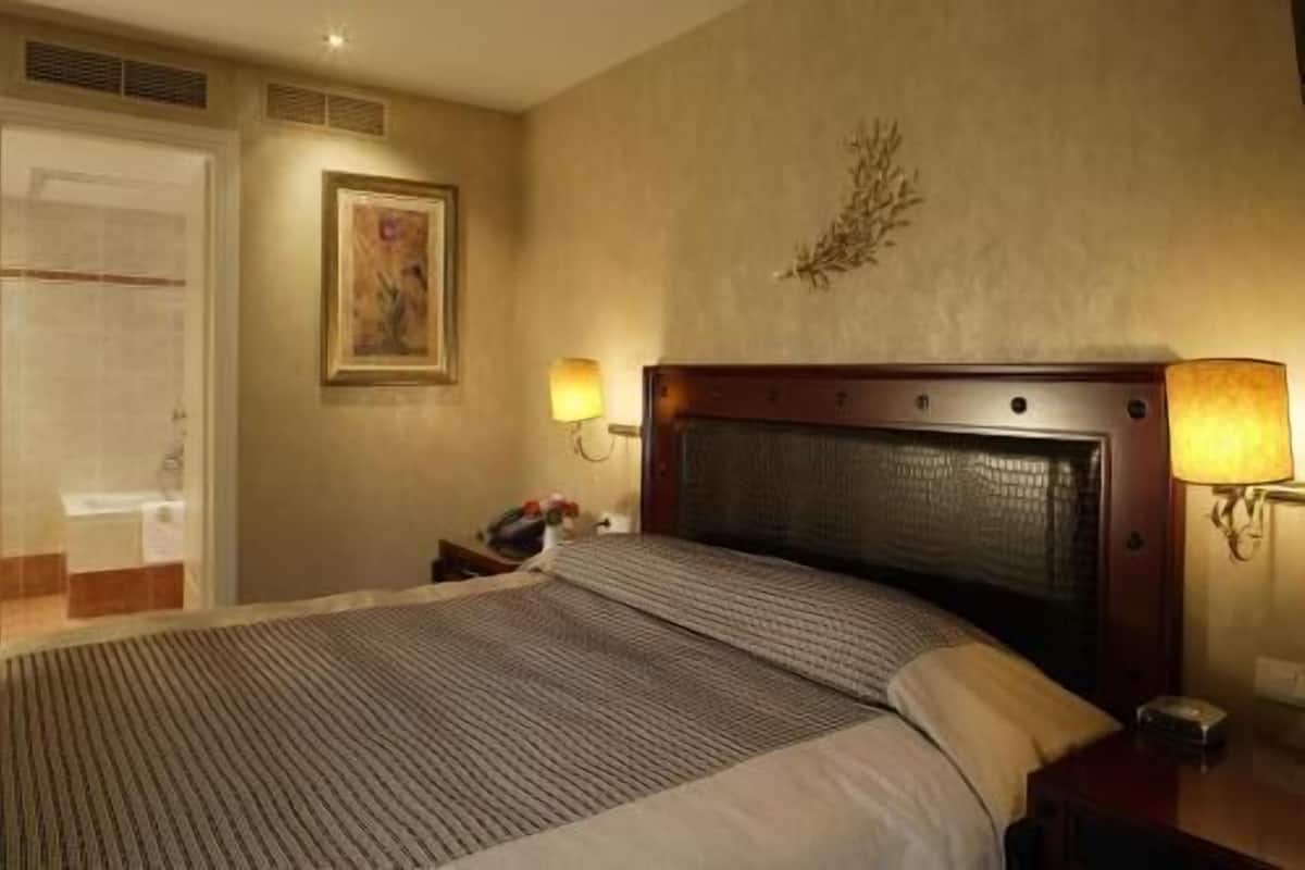 Ropa de cama de alta calidad y minibar