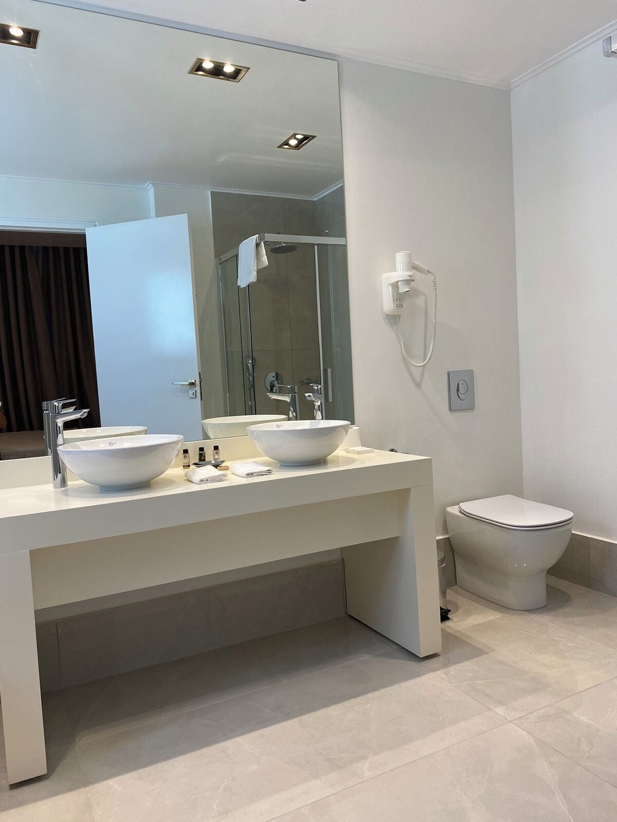 top-floor design suite | bathroom | free toiletries, hair dryer, bathrobes, slippers
