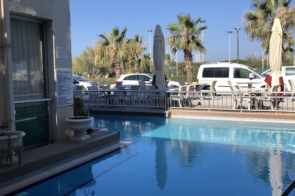 Outdoor pool, pool umbrellas, sun loungers