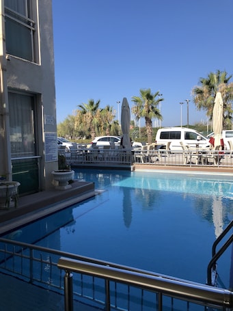 Outdoor pool, pool umbrellas, sun loungers