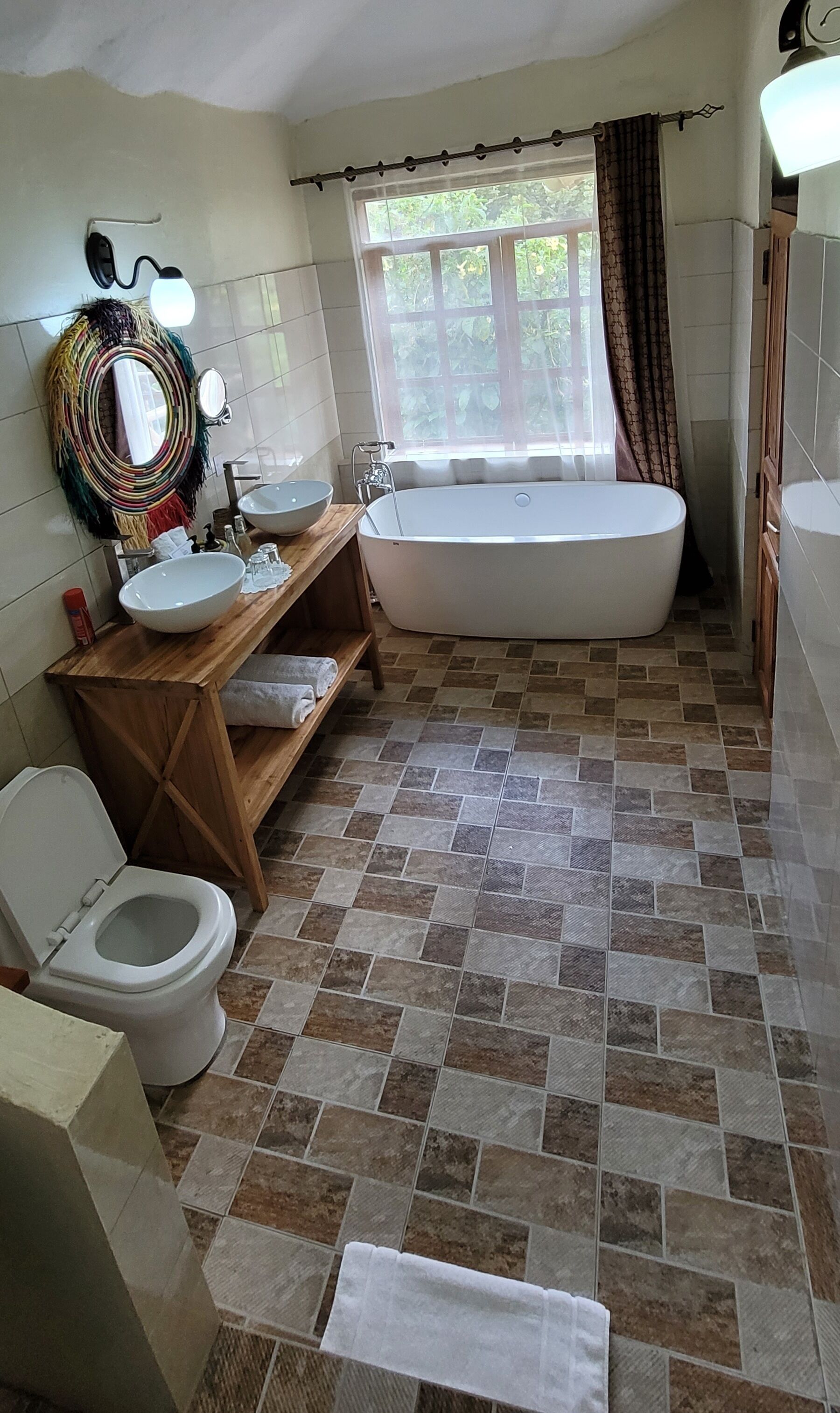 A bathroom with a bathtub, toilet, and sink.