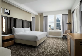 Hotel amenities such as safe, desk and work area at Hotel Flor Tampa Downtown, Tapestry Collection by Hilton