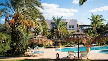 Indoor pool, outdoor pool, open 10 AM to 6 PM, pool umbrellas