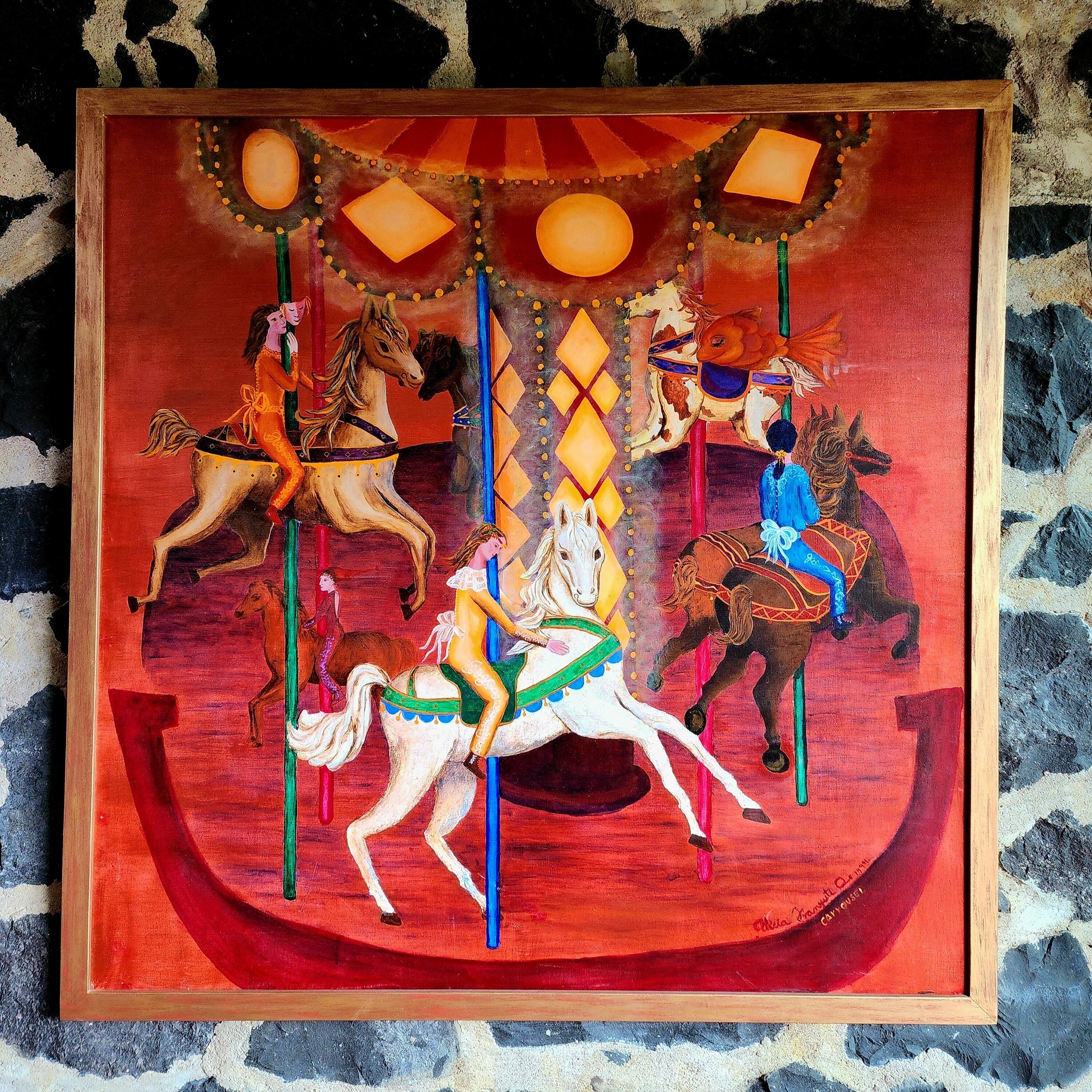 A carousel with horses and riders, painted in vibrant colors, mounted on a circular platform with a red background.