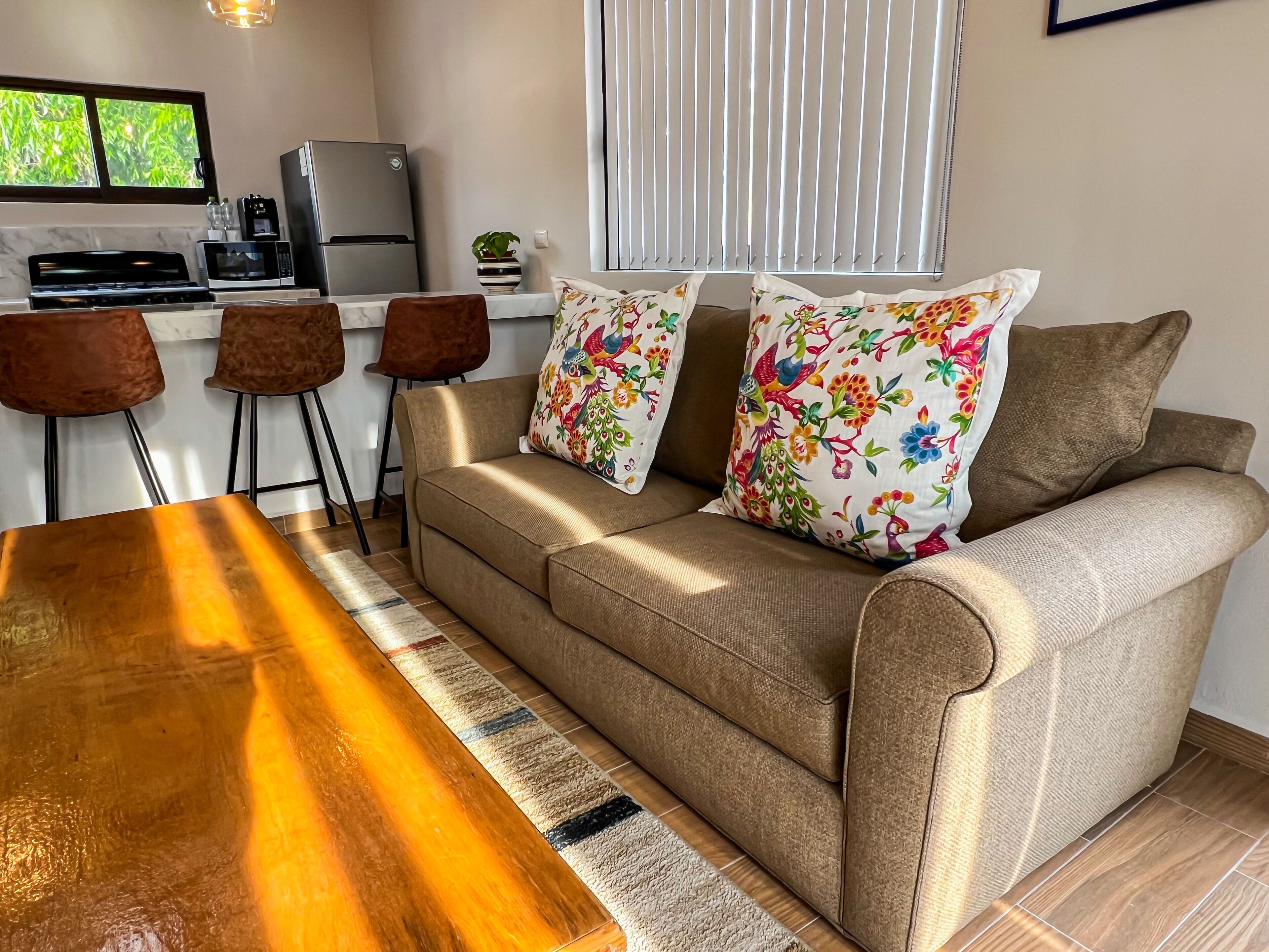 deluxe apartment, city view | living area | 50-inch smart tv with cable channels, tv