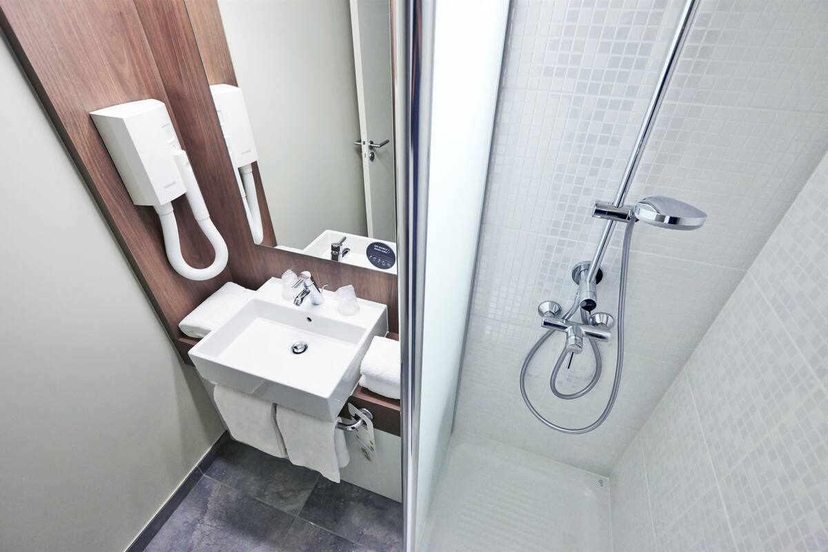 shower, eco-friendly toiletries, hair dryer, towels