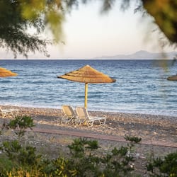 On the beach, sun loungers, beach umbrellas, beach towels