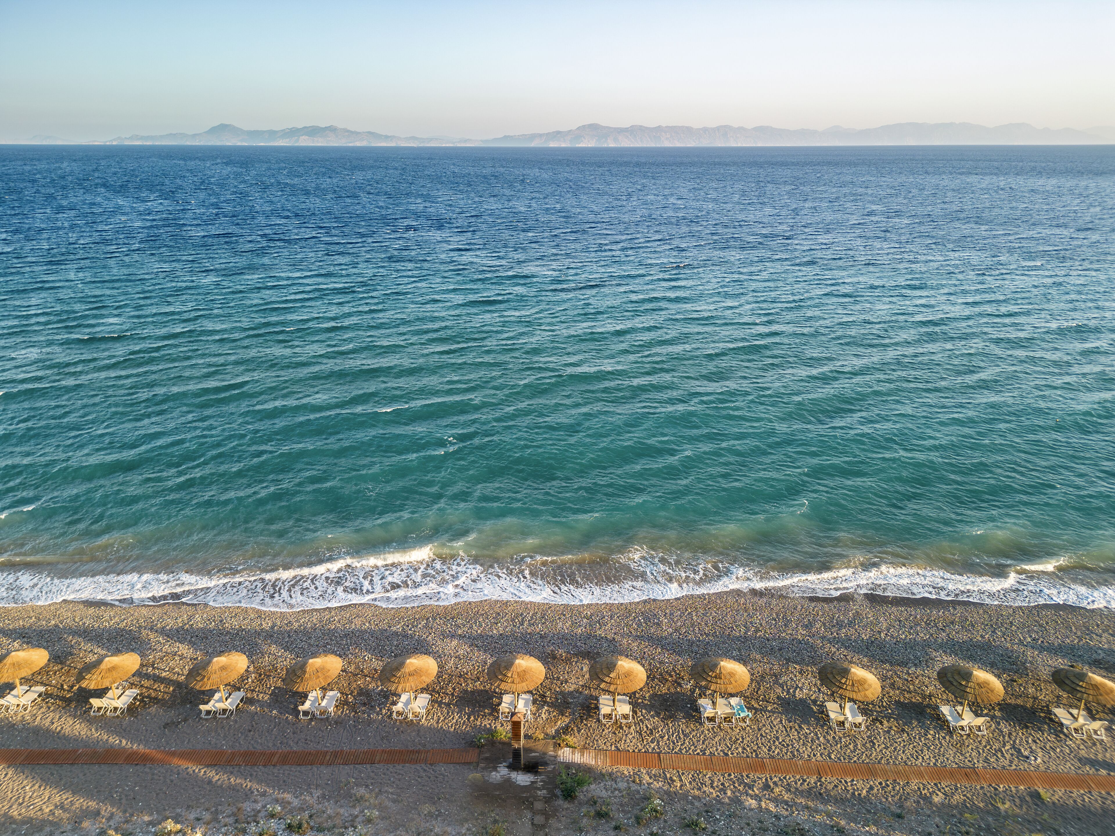 On the beach, sun loungers, beach umbrellas, beach towels