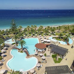 Indoor pool, outdoor pool, pool umbrellas, pool loungers