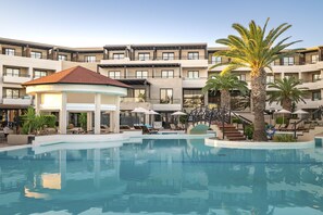 Indoor pool, outdoor pool, pool umbrellas, pool loungers