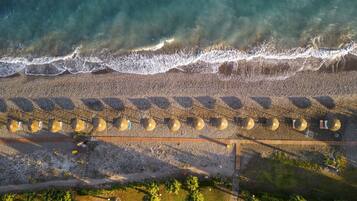 On the beach, sun loungers, beach umbrellas, beach towels