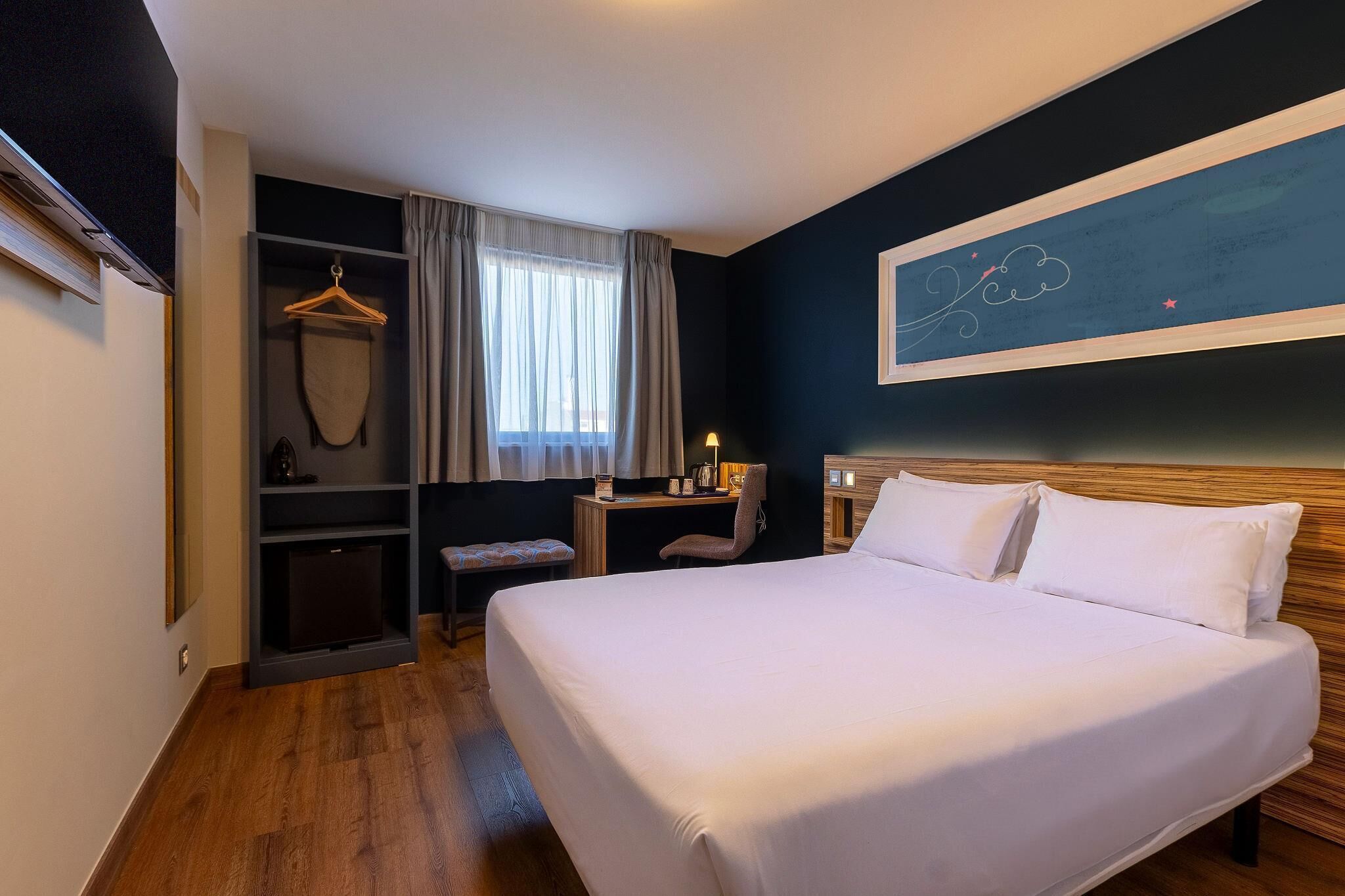 Premium bedding, pillow-top beds, desk, blackout curtains