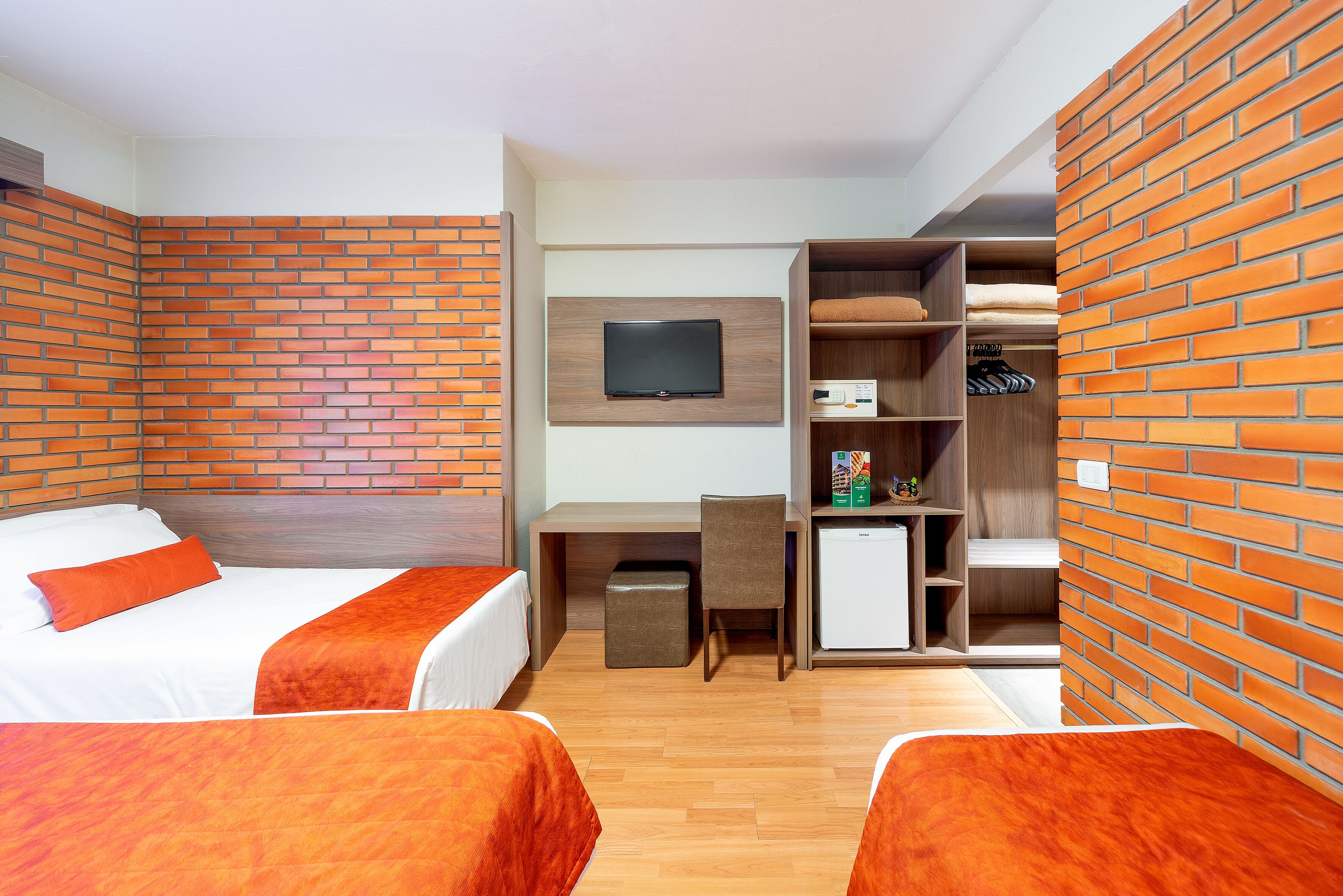 deluxe quadruple room | minibar, in-room safe, desk, soundproofing