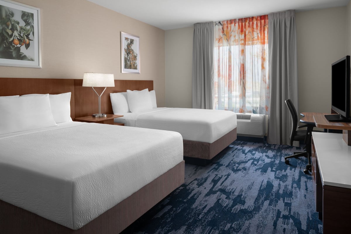 Premium bedding, desk, laptop workspace, iron/ironing board