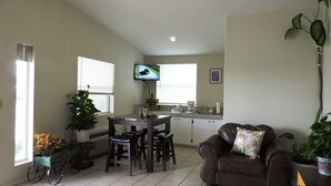 A compact living space with a kitchen, dining area, and a seating area. - Riata Inn Crystal City (Crystal City)