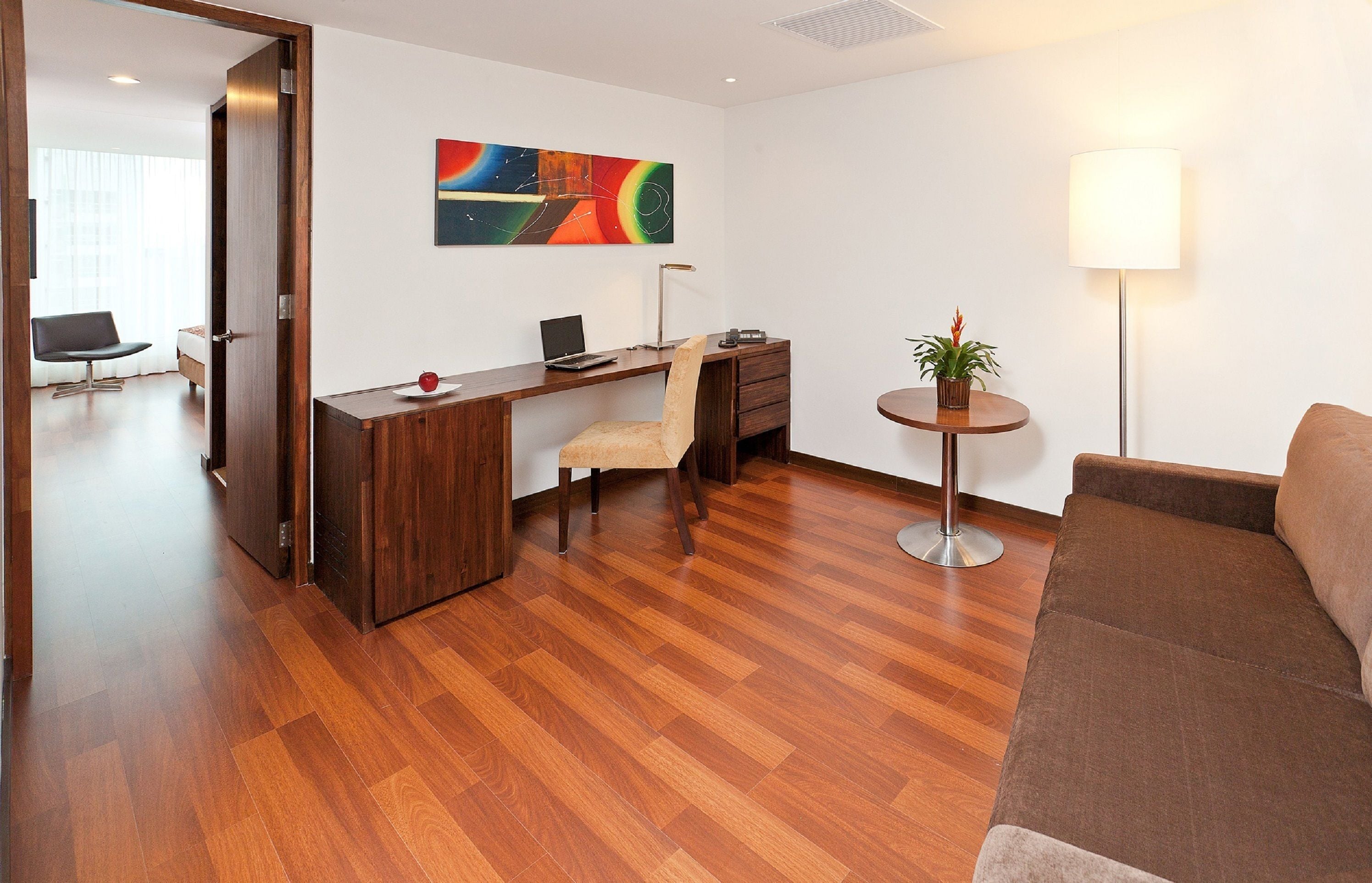 deluxe room, 1 king bed | living room | 42-inch plasma tv with cable channels, tv