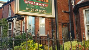 A sign for Heathfield Bed & Breakfast with a contact number. - Heathfield B&B Guest House (Whitby)