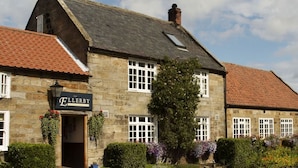 A stone building with a sign reading "The Ellery." - The Ellerby Country Inn (Saltburn-by-the-Sea)