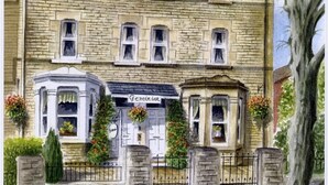 A two-story stone building with a sign reading "Geminian." - Geminian Guest House (Harrogate)